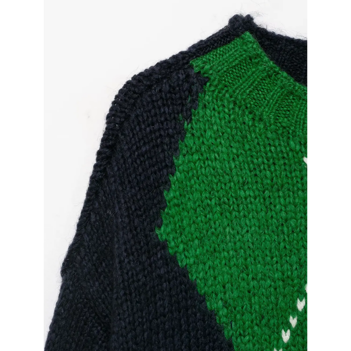 Close-up of green diamond shoulder detail