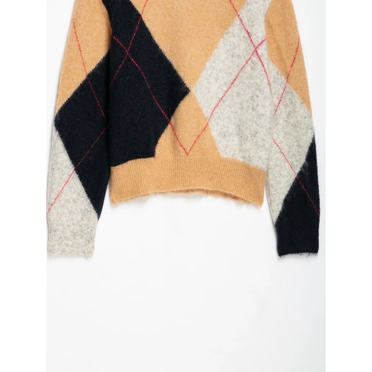 Close-up of cropped hem and sleeve argyle pattern
