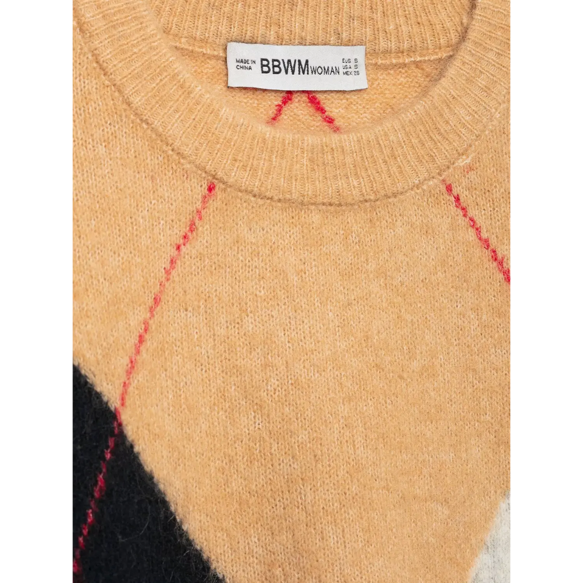 Close-up of inner label and red argyle stitching