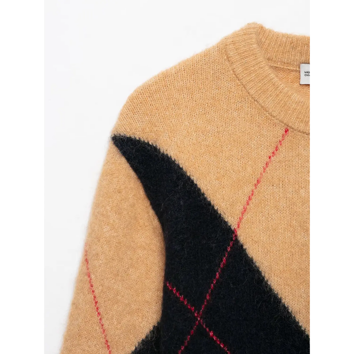 Close-up of shoulder and argyle diamond pattern