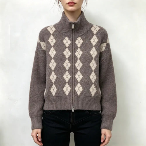 Model wearing argyle full zip high neck cardigan with jeans, front view