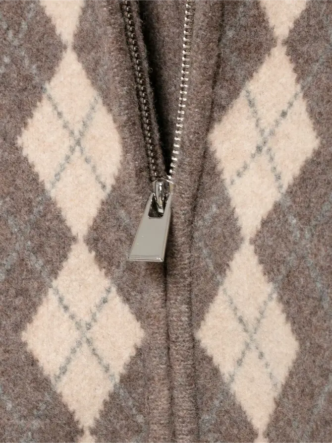 Macro close-up of silver metal zipper pull