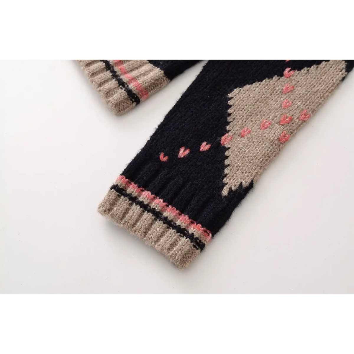 Close-up of ribbed cuff and argyle sleeve