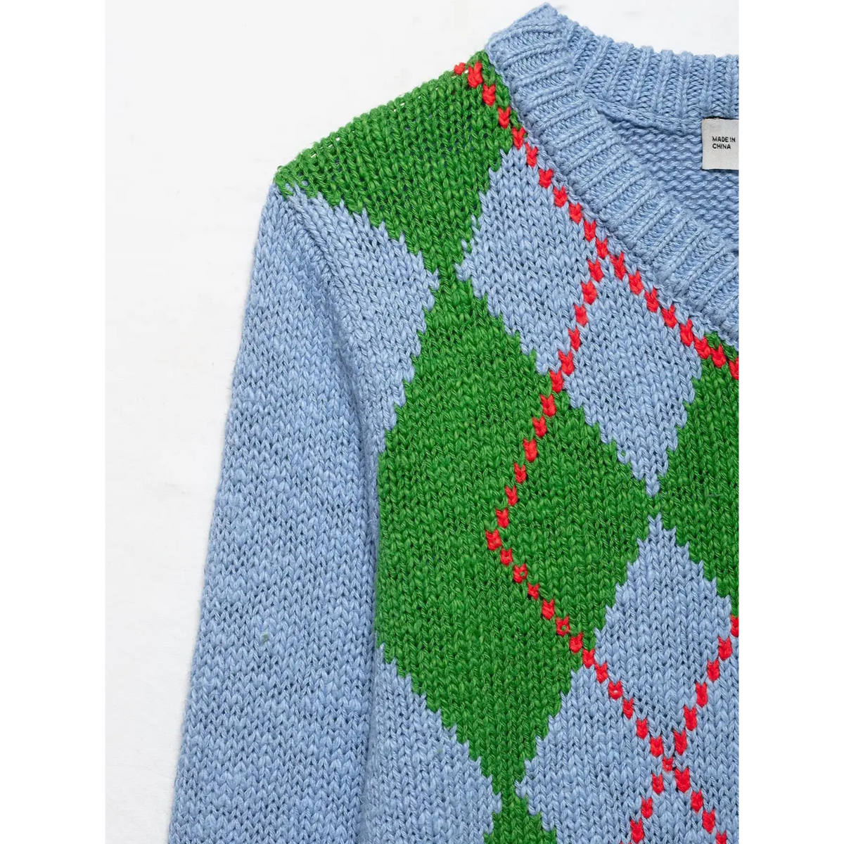 Close-up of shoulder and green argyle diamond
