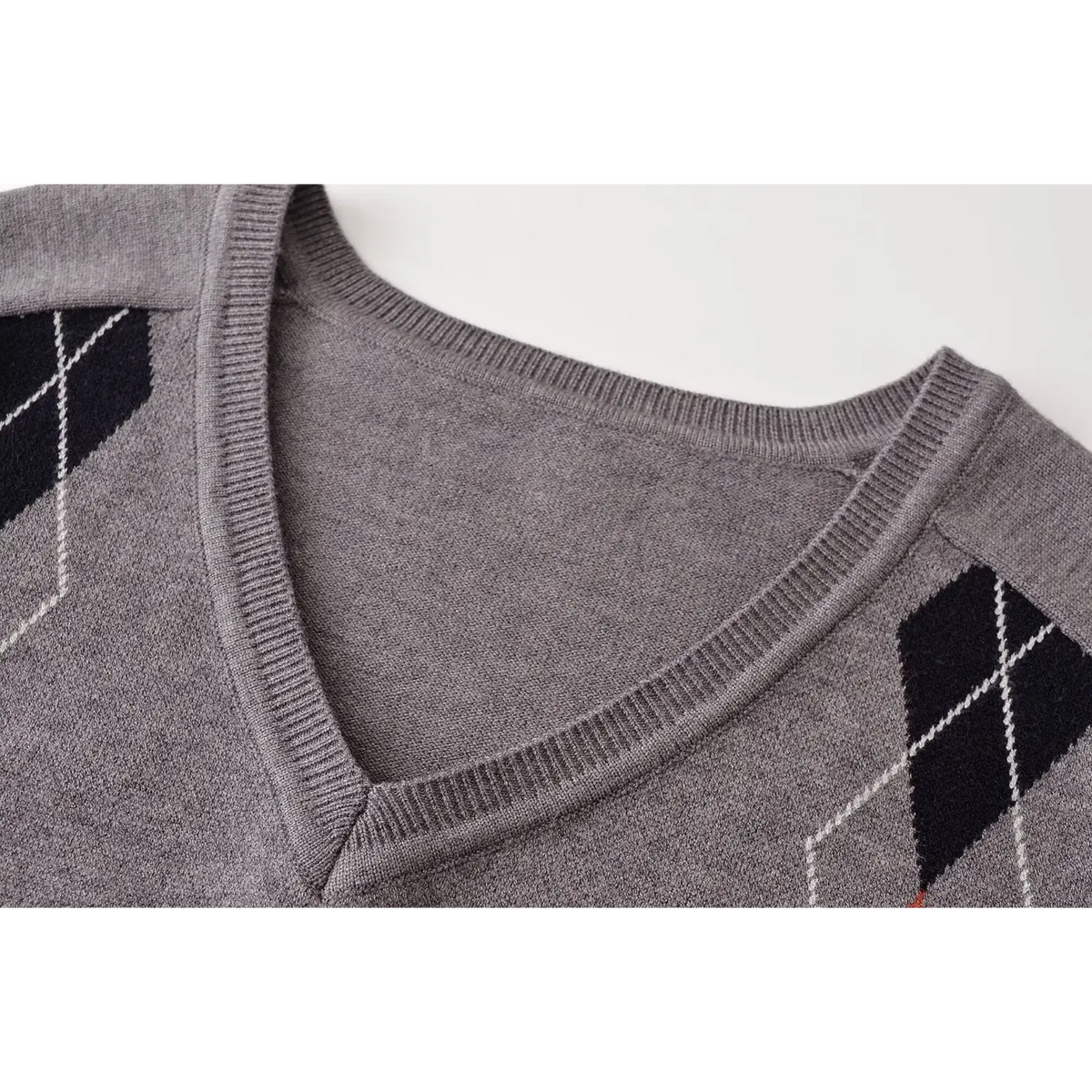 Close-up of ribbed V neck binding and stitch detail