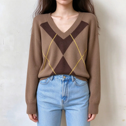Model wearing argyle v neck oversized sweater with jeans, front view