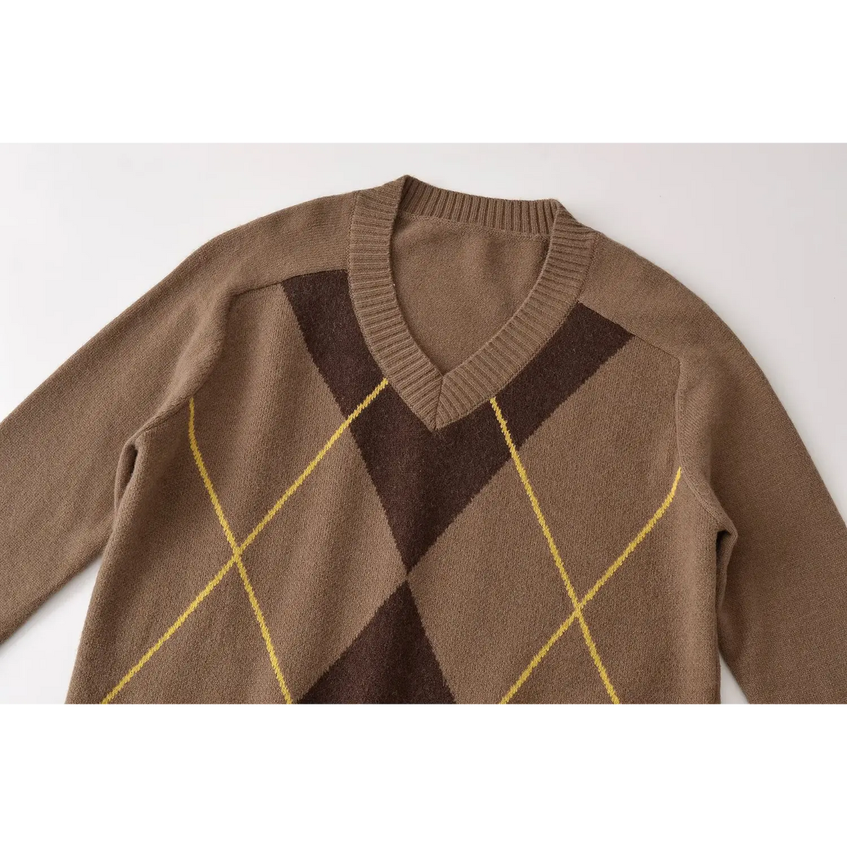 Close-up of v neck and argyle pattern