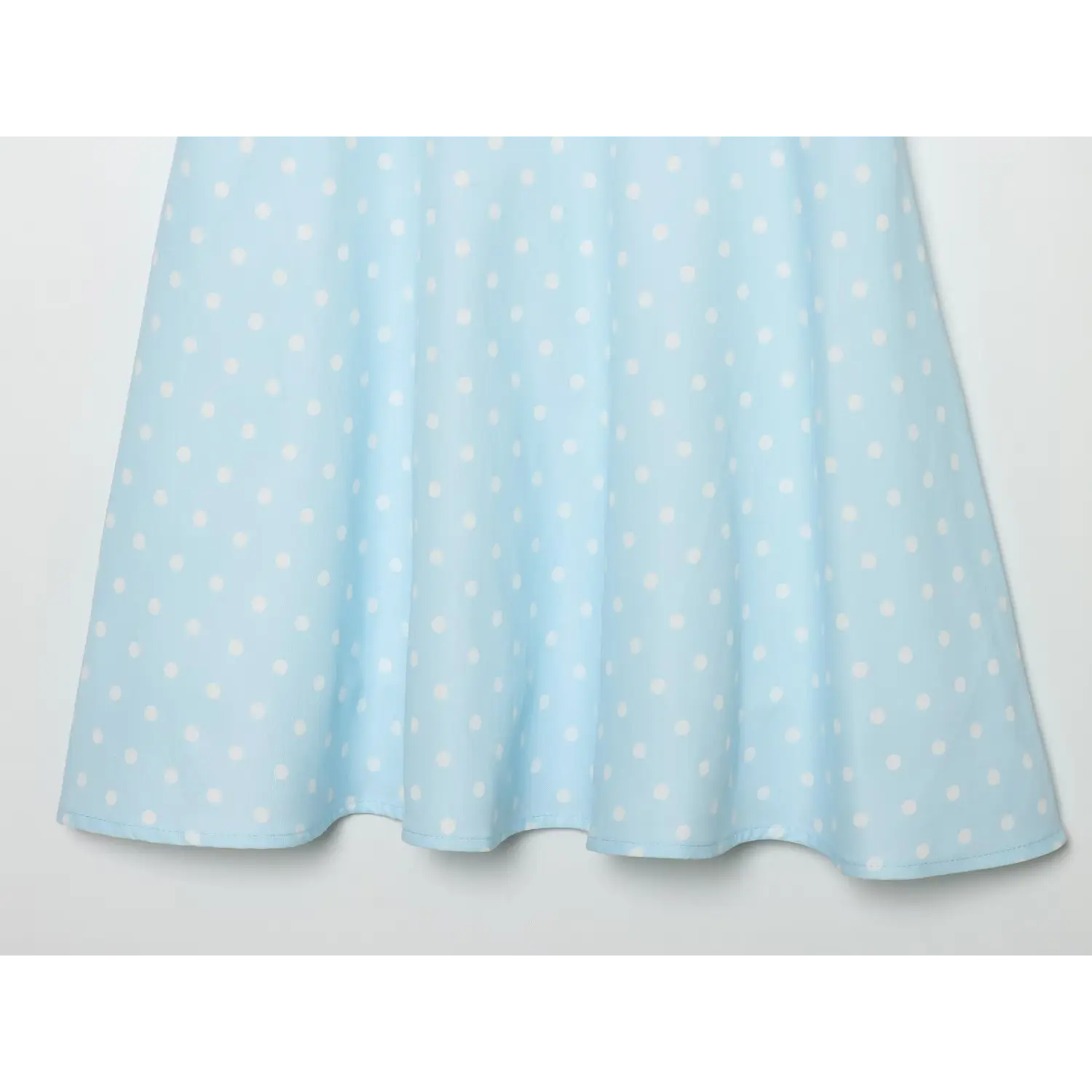 Babyblue white polka dot dress flared skirt hem partial view,flowing a‑line skirt