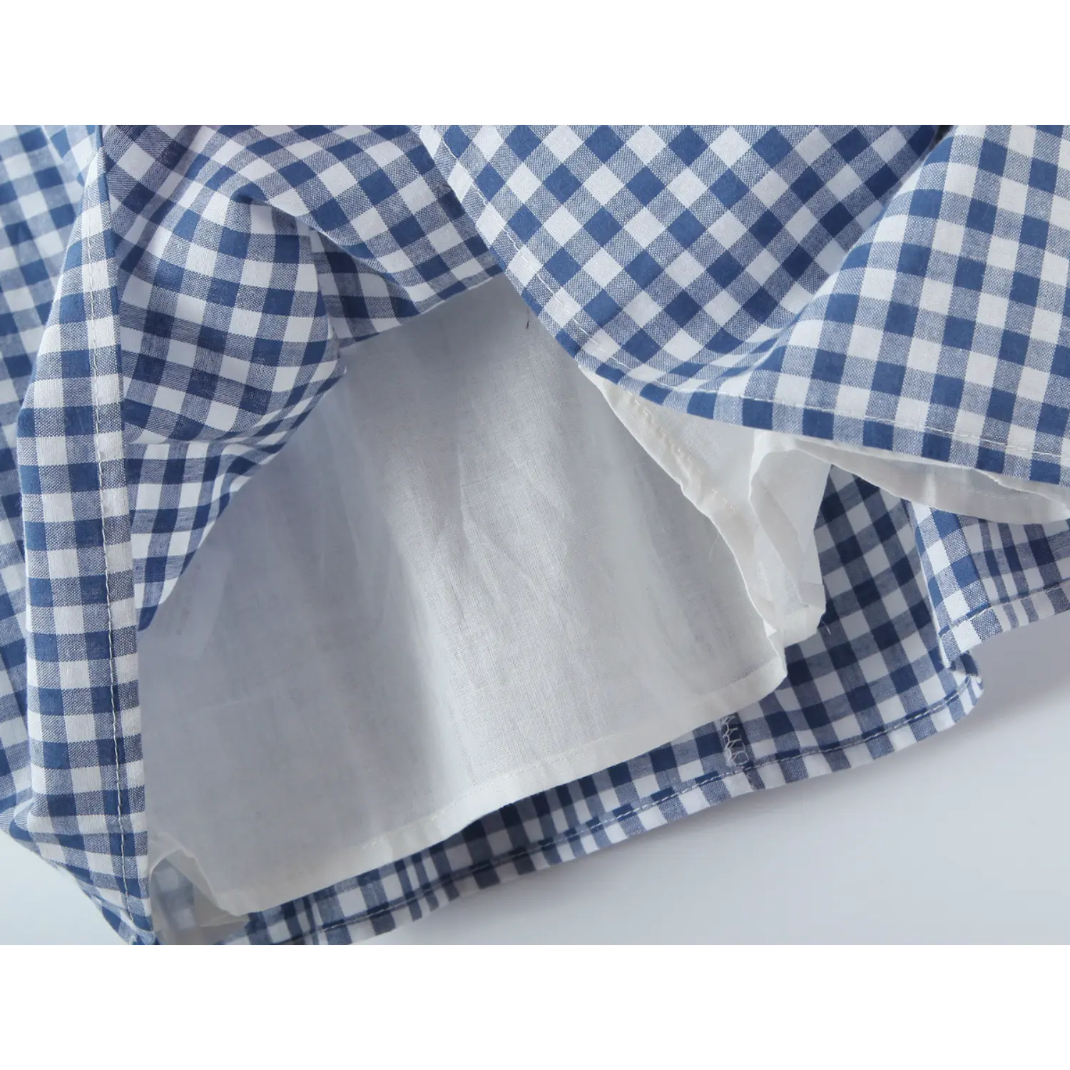 Back full smocked elastic panel macro close-up, dense horizontal stretch shirring center teardrop invisible zipper unrestricted stretch waist back structure shot
