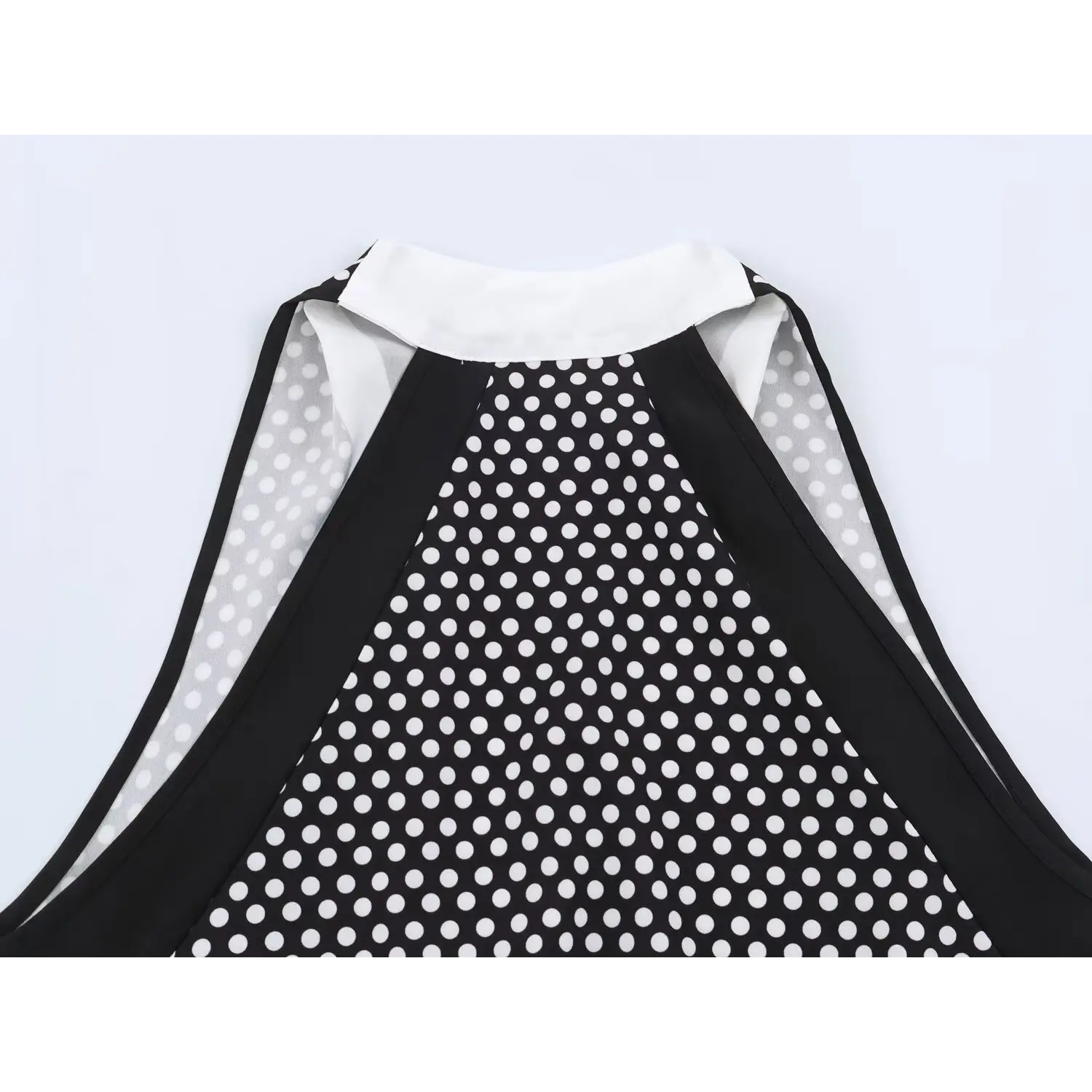 Back halter neck partial close-up, wide sleeveless cutout frame, vertical polka dot fabric drape