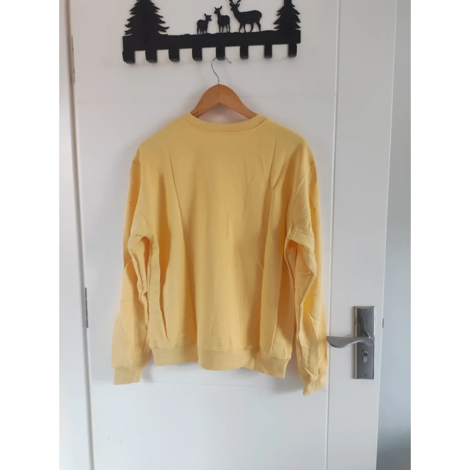 Back hanging view solid yellow casual long sleeve crewneck sweatshirt