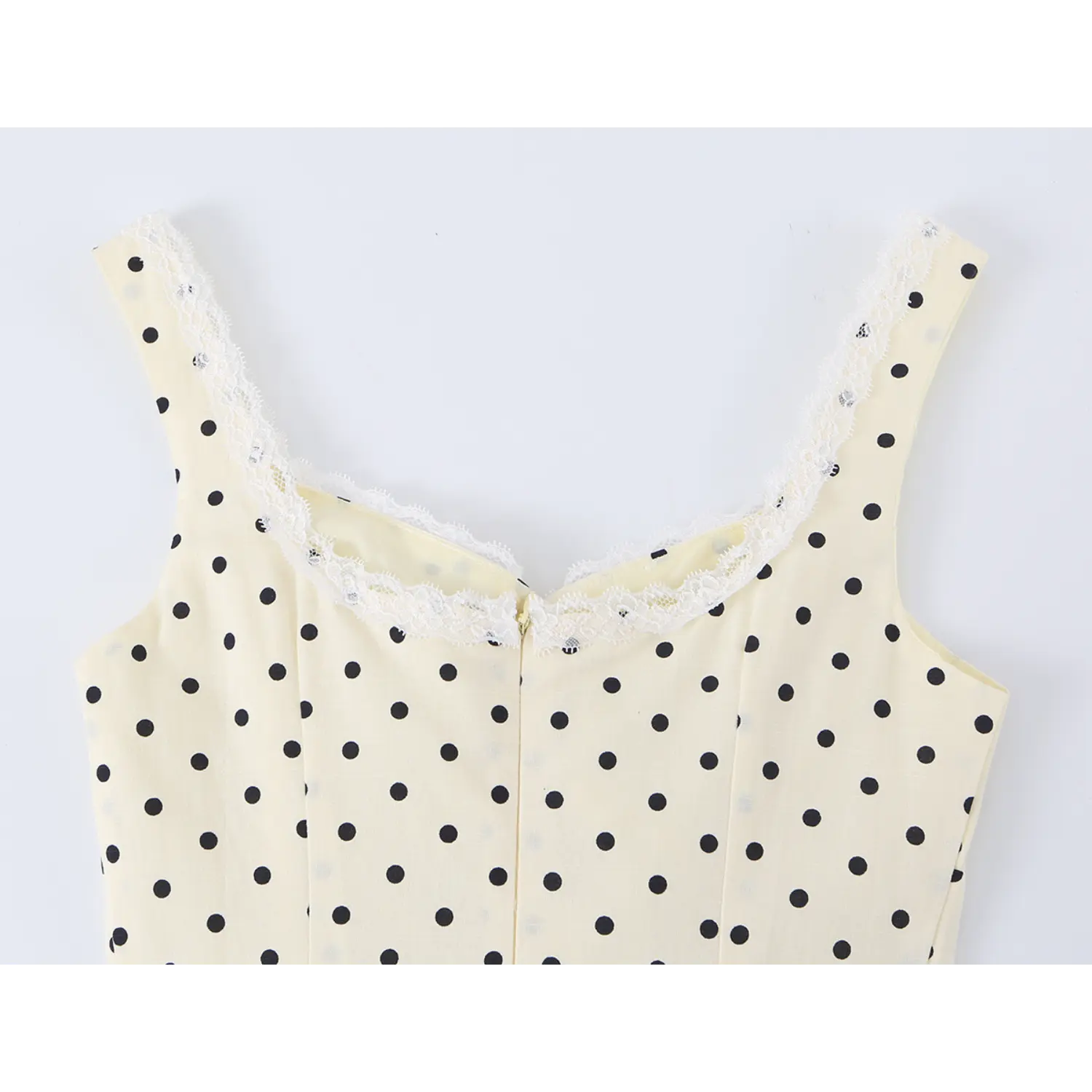 Center back invisible zipper macro close-up, matching cream fabric tape, smooth metal pull tab