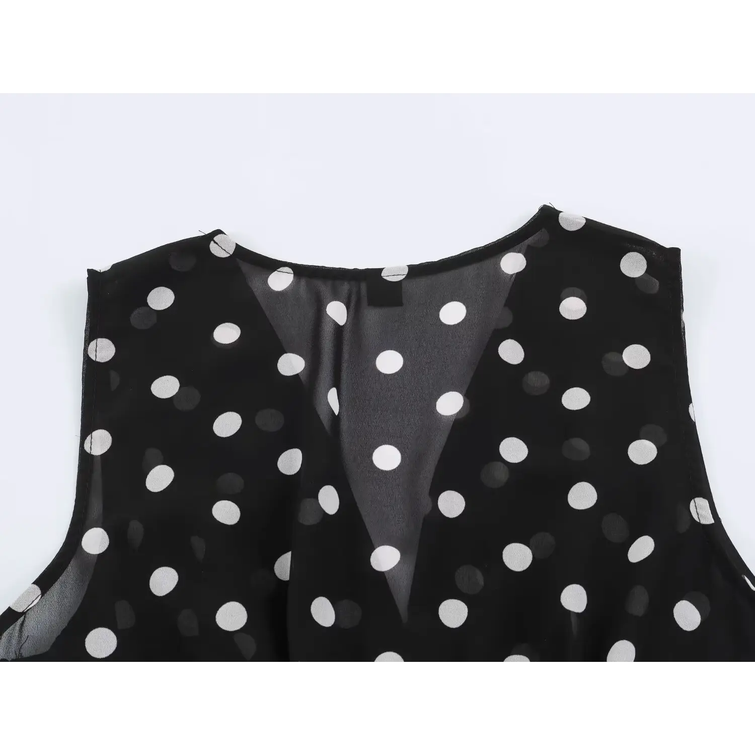 Full back neckline flat partial shot, sleeveless wide shoulder cut, uniform polka dot chiffon drape
