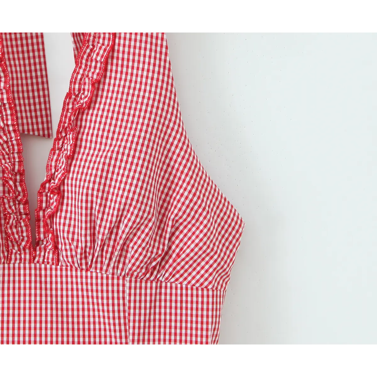 Back elastic smock & decor button closeup on gingham dress