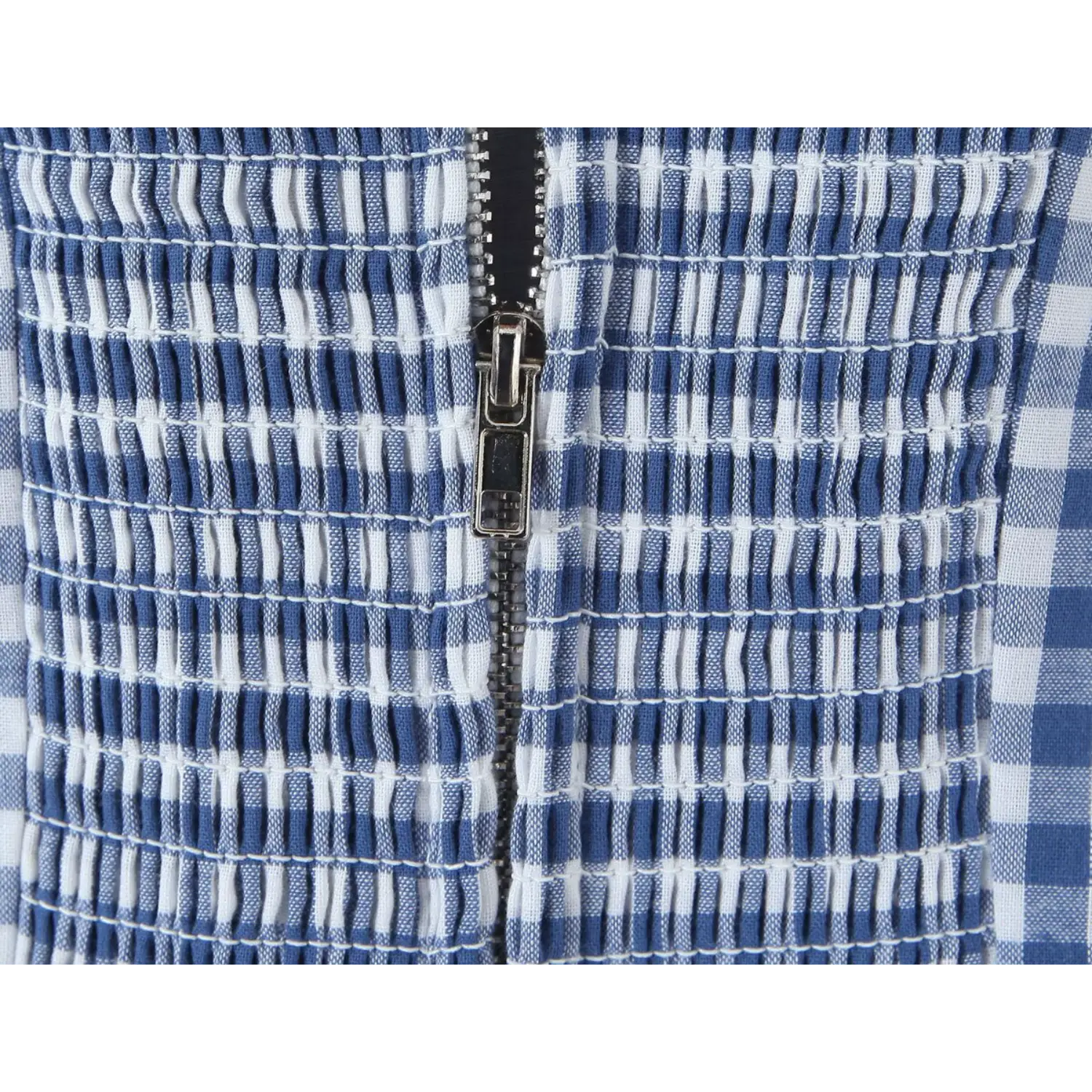 Back full stretch smocked panel metal invisible zipper macro close-up, dense horizontal elastic shirring center hidden metal tooth zipper smooth slide waist shaping craft shot