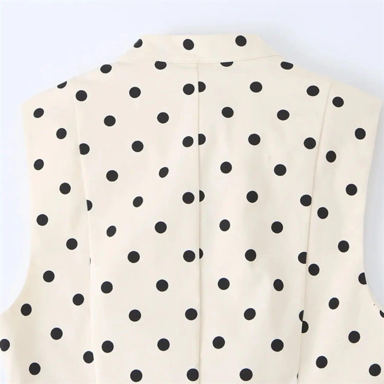 Rear neck & upper back macro shot, full horizontal back yoke stitching, symmetrical sleeveless armhole panels, uniform dot print alignment