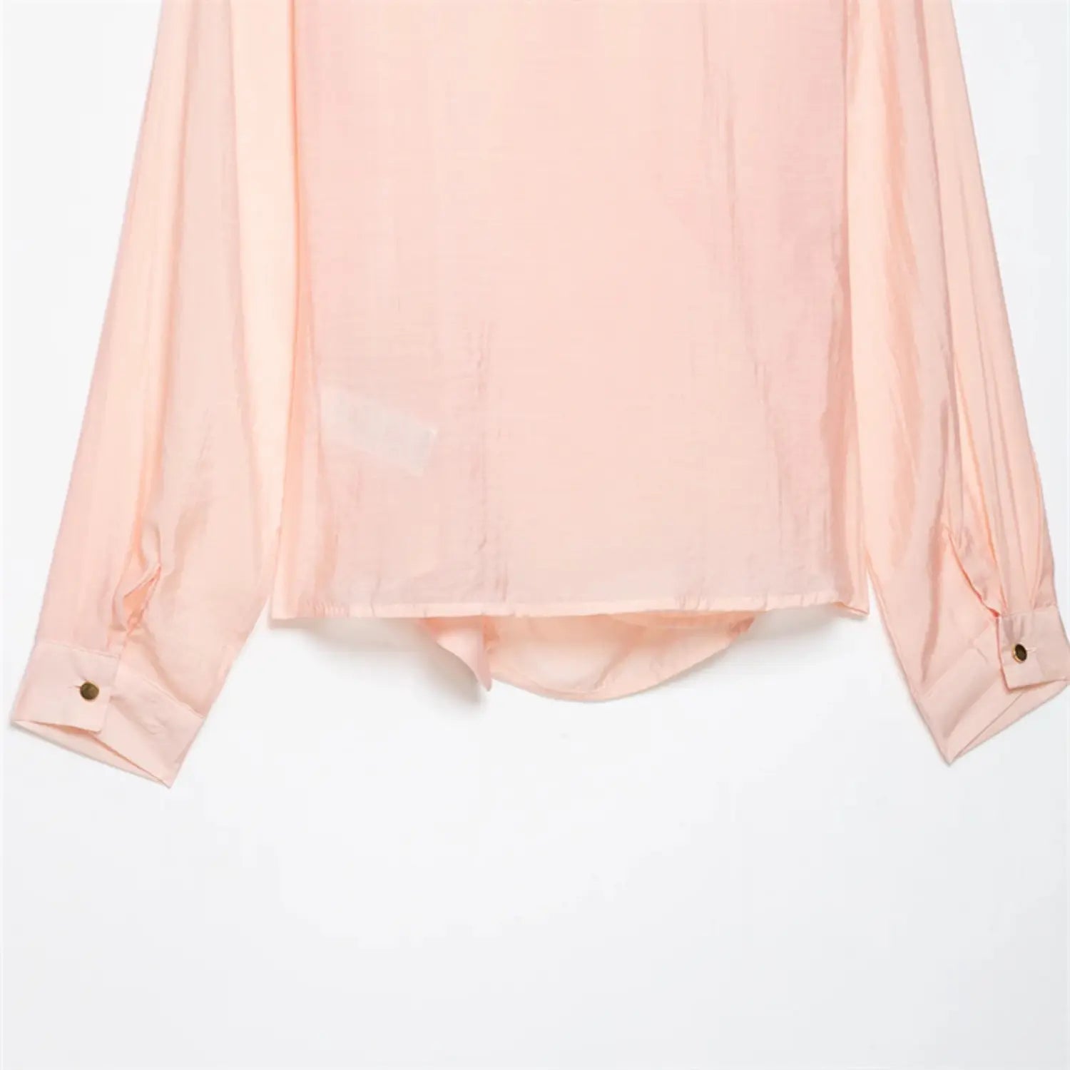 Rear bottom hem partial view, asymmetrical curved uneven hem, double layer folded edge, soft flowy satin drape texture