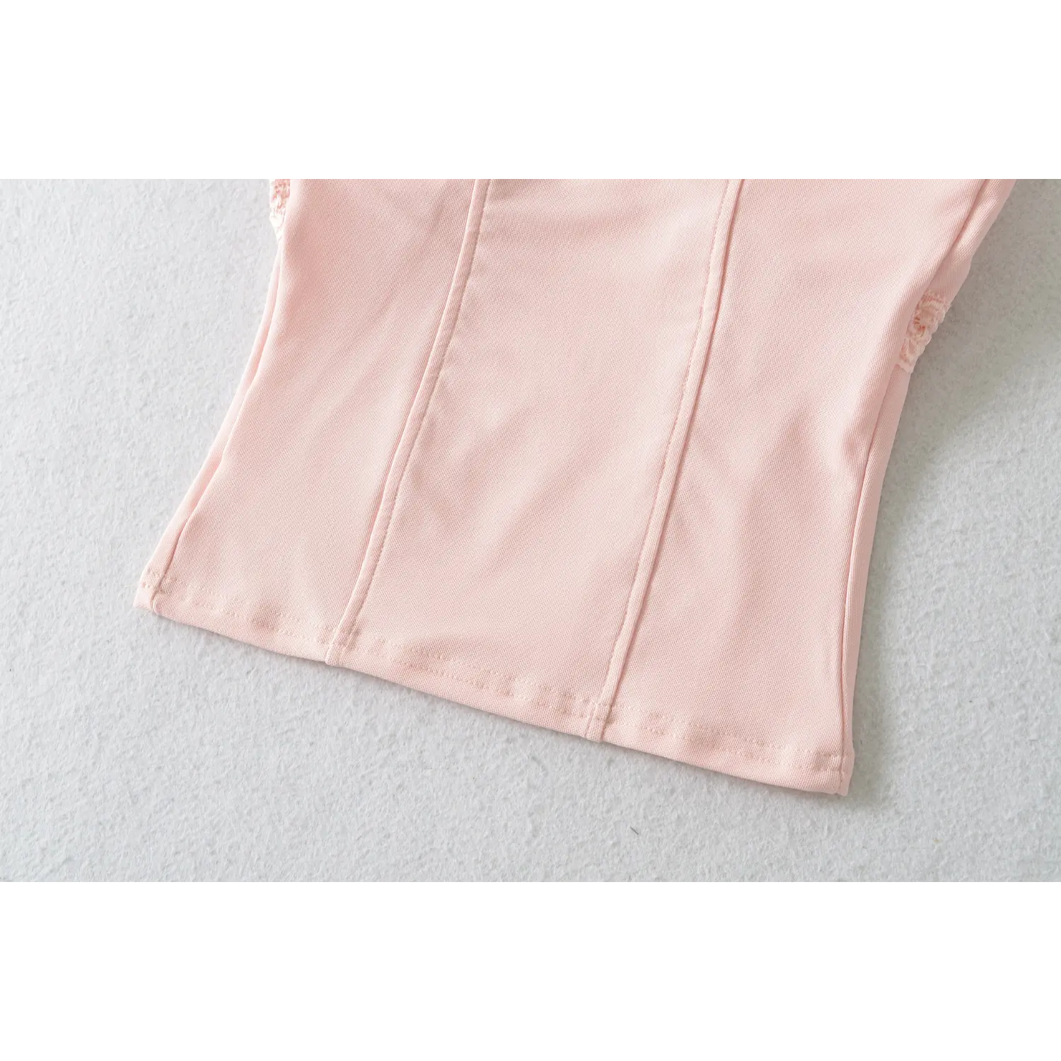 Rear waist and hem partial shot, tailored darts for curvy fit, neat bottom edge hemming craft