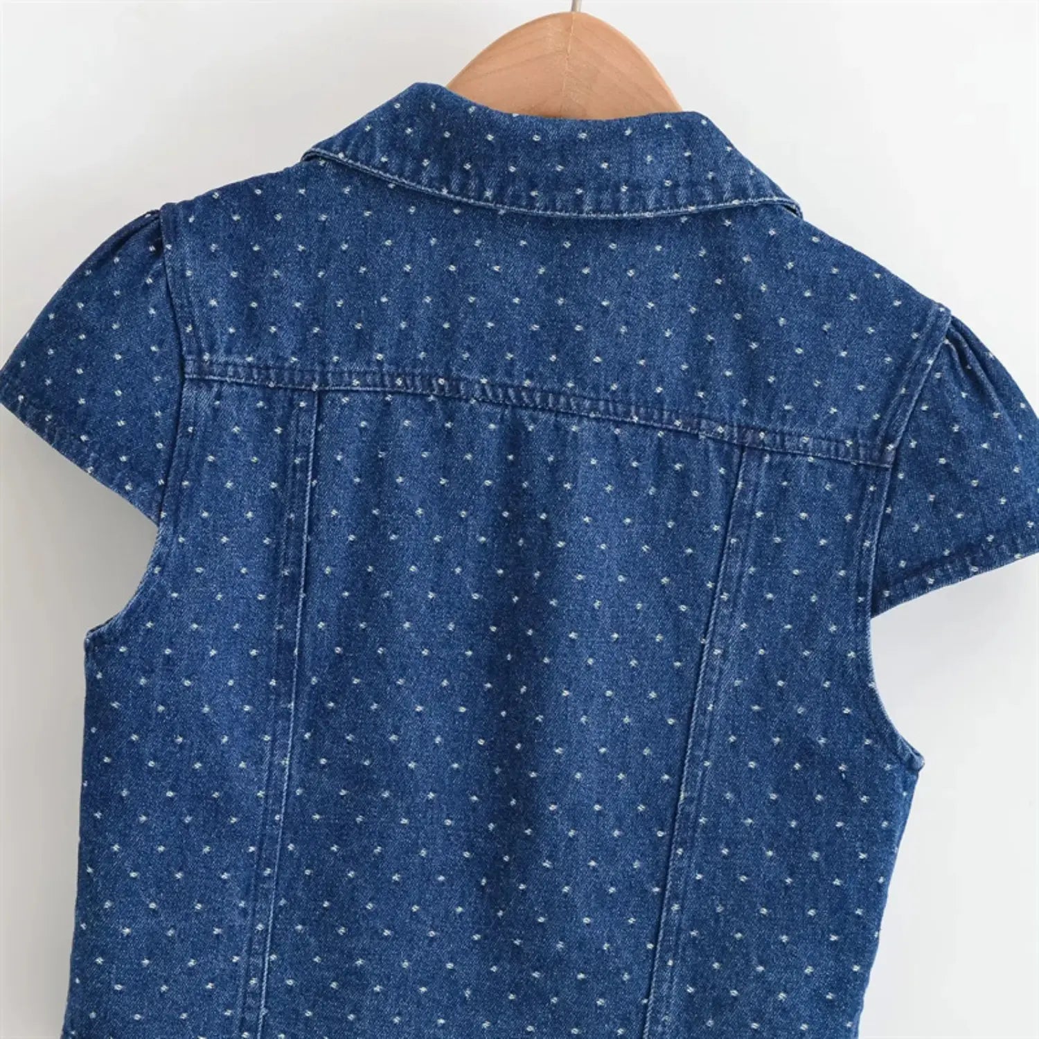 Rear shoulder & cap sleeve macro shot, horizontal back yoke stitching, sleeve shoulder gathering pleats, denim dot print alignment