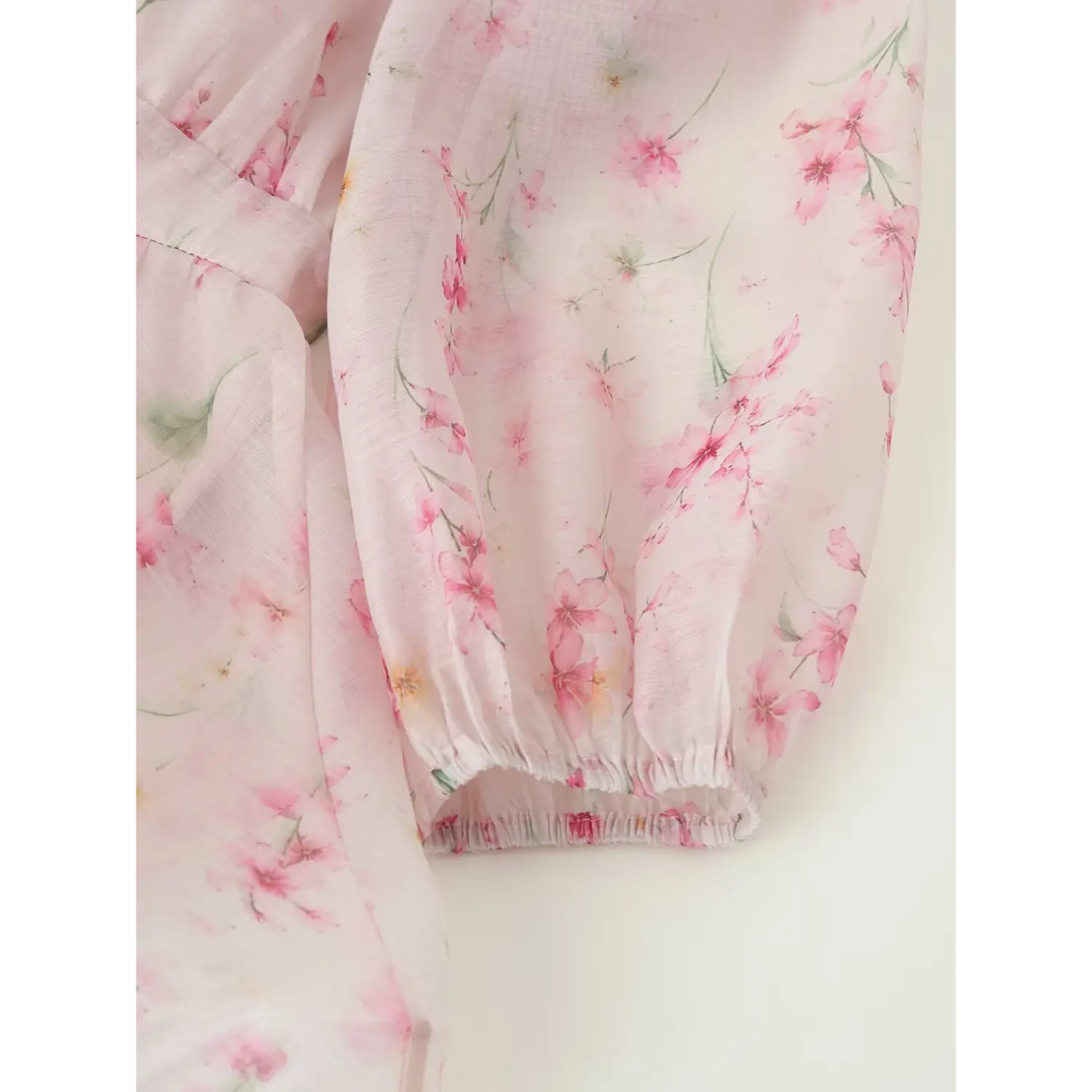 Long sleeve cuff close-up, gathered elastic balloon cuff, sheer floral chiffon drape texture