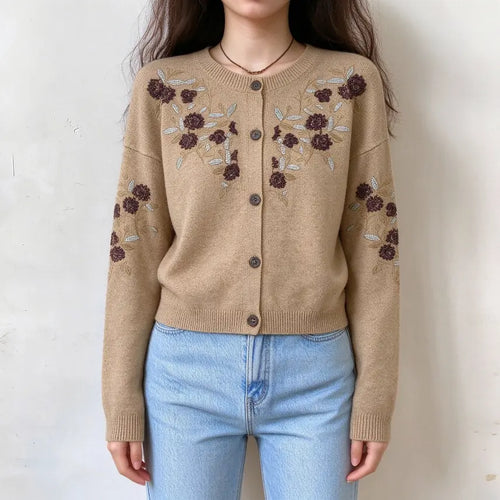 Model wearing beaded floral embroidered round neck cardigan with jeans, front view