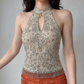 Model front wearing shot beige lace halter tank top with silver floral beading keyhole cutout and fringe hem