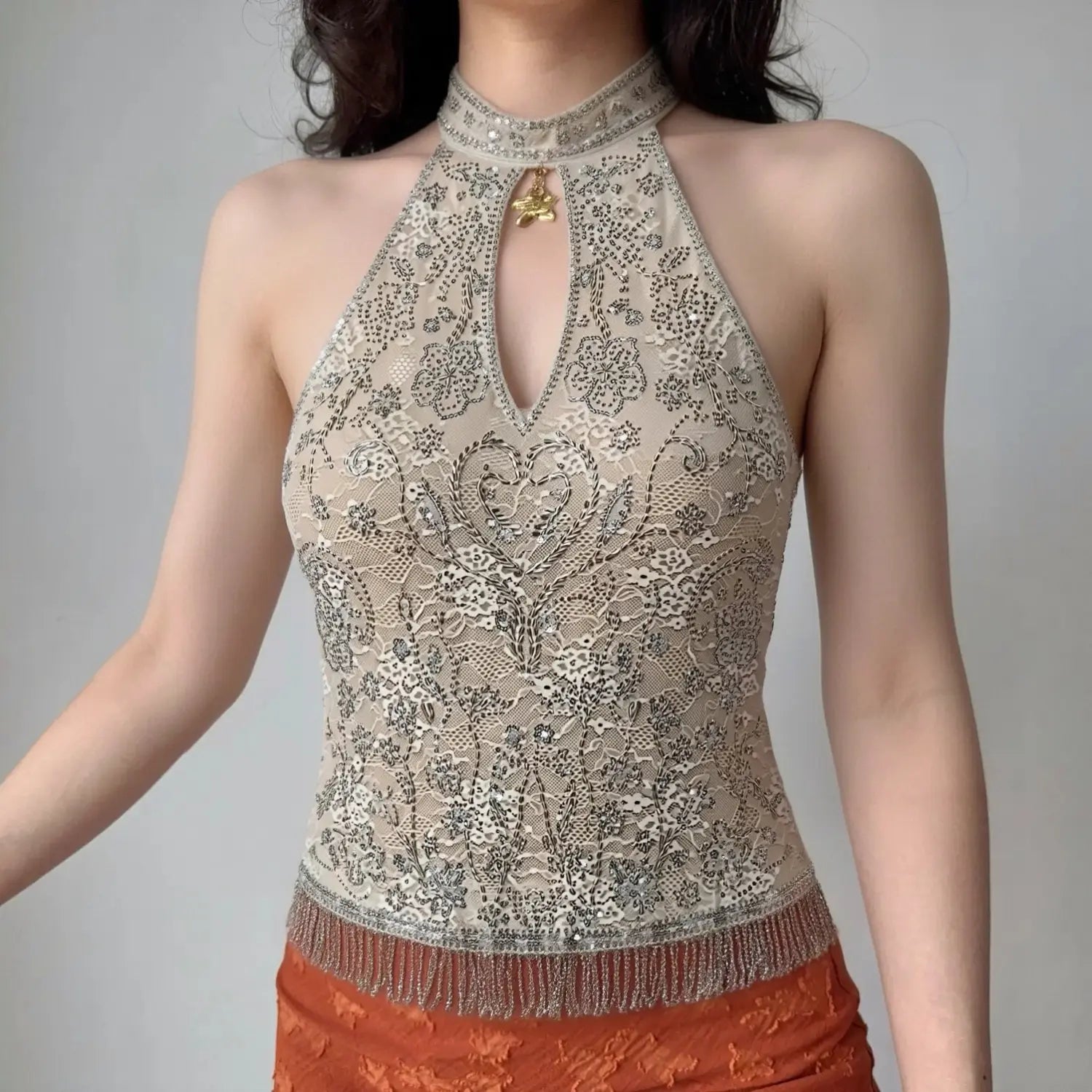 Model front wearing shot beige lace halter tank top with silver floral beading keyhole cutout and fringe hem