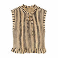Front view of the top, showing the tie-neck keyhole detail, smocked texture, and cap sleeves.
