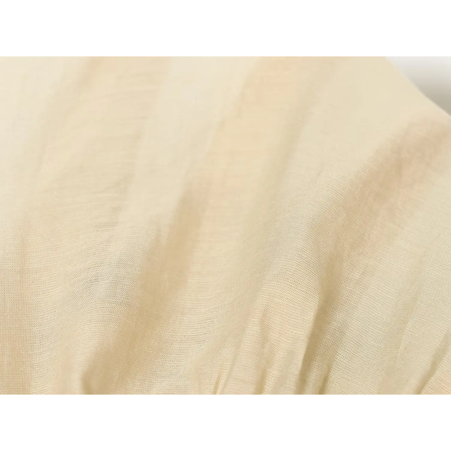 Close‑up fabric texture of lightweight flowy beige corset blouse