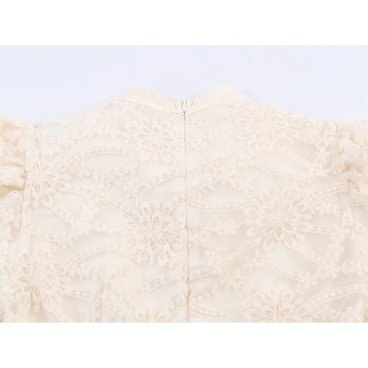 Back top view of beige floral embroidered mini dress, high neck, full back floral lace pattern and center zipper