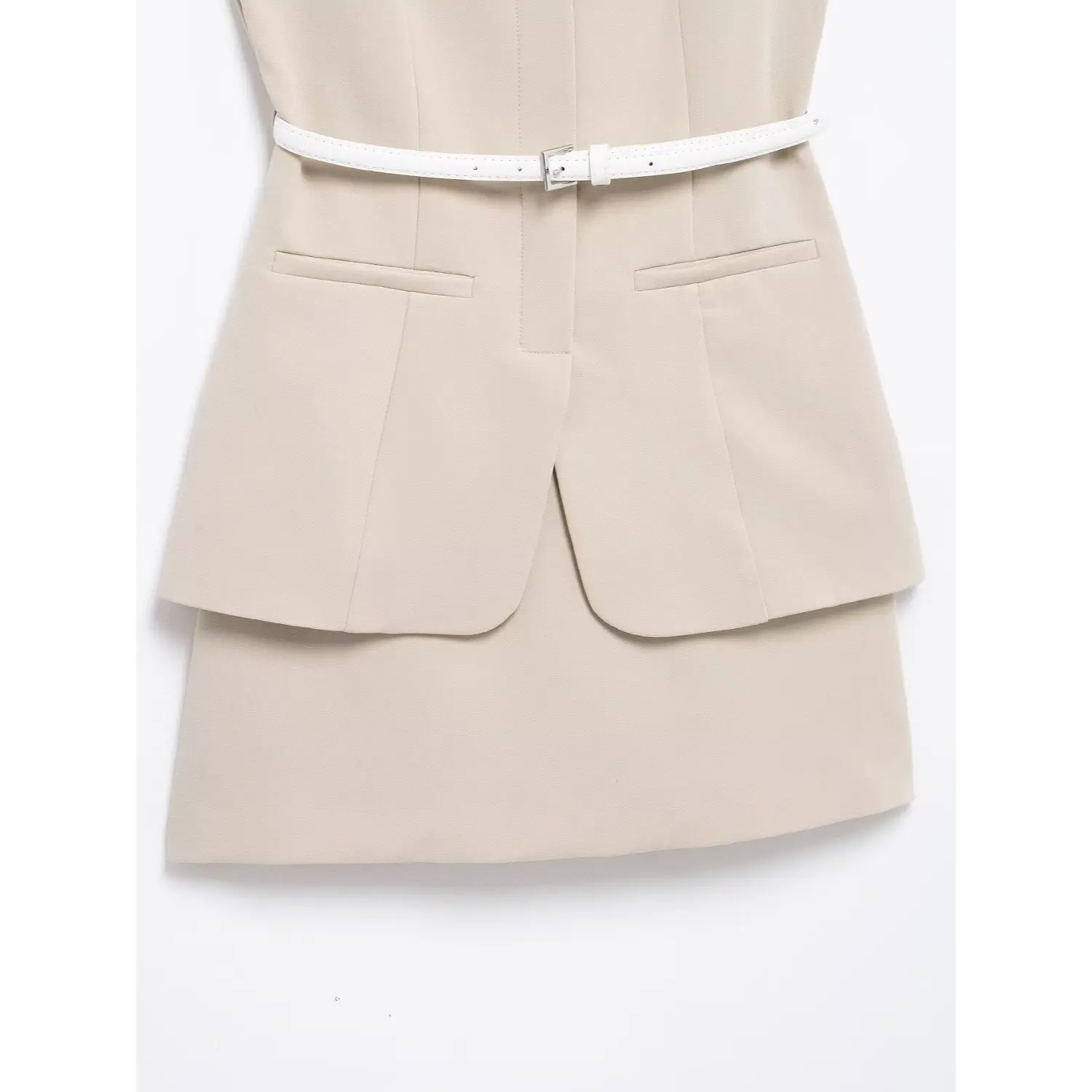 Front lower torso flat view, dual fake welt pockets on blazer overlay, split curved hem, straight mini skirt underneath, uniform tailored stitching lines