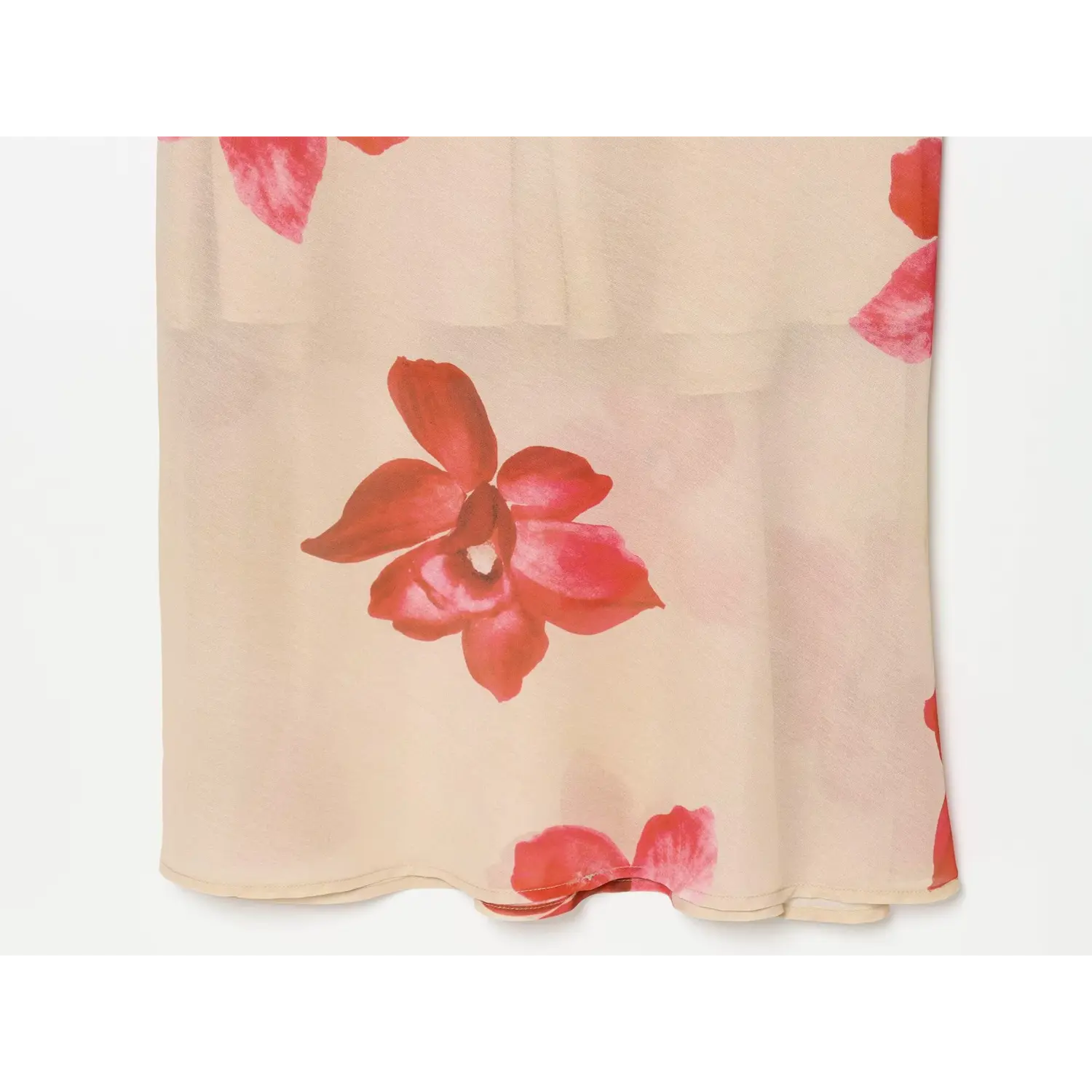 Close-up of long skirt print on beige floral maxi dress, scattered red pink flowers, lightweight fabric