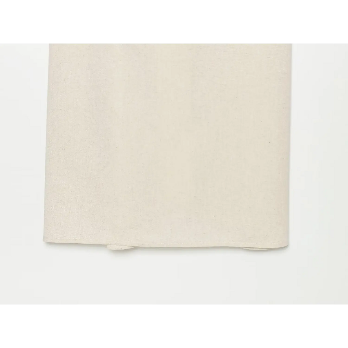 Close-up of relaxed beige linen skirt fabric