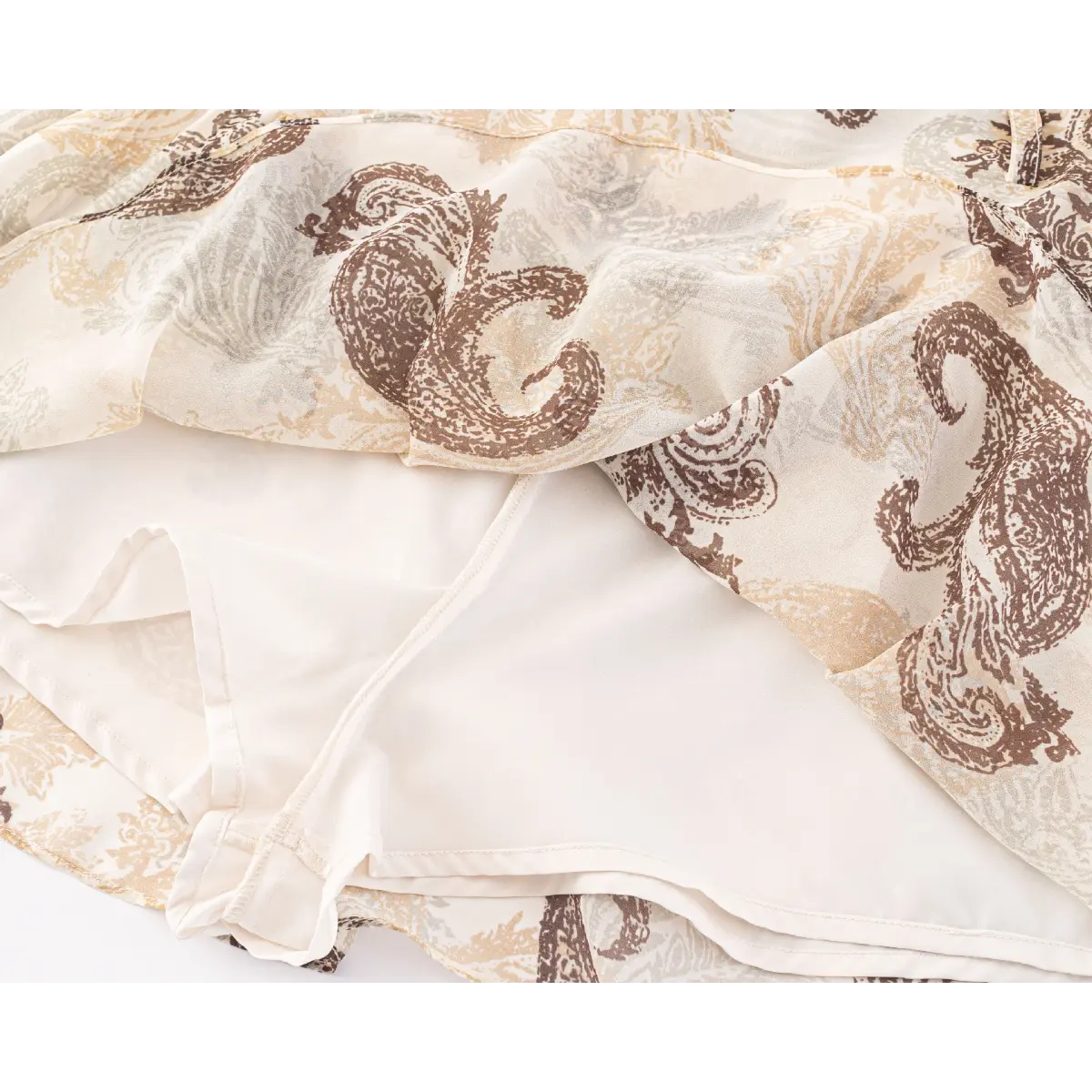 Close-up of the skirt hem, layered fabric, and inner lining construction.