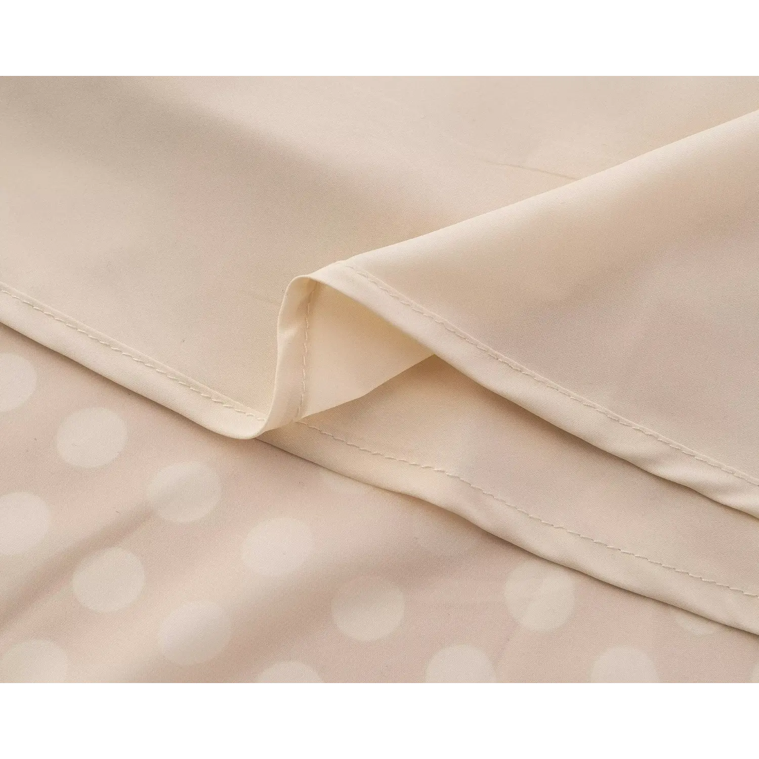 Close‑up of soft inner lining and fine finished seam workmanship for beige polka dot chiffon midi dress