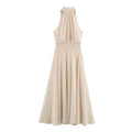 Front view beige polka dot halter maxi dress, sleeveless flowy long dress with smocked waist