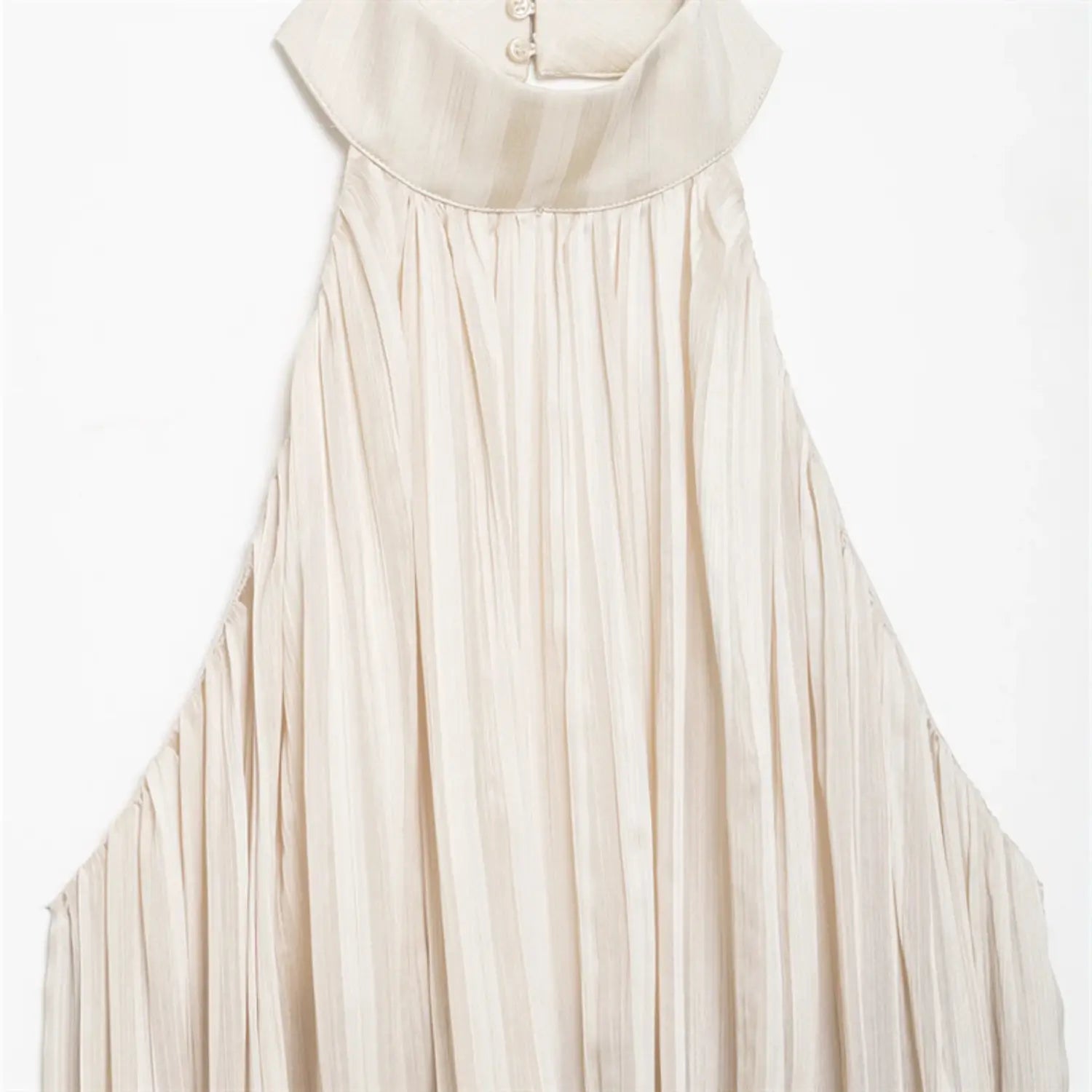 Partial close-up of folded stand halter collar, back three pearl buttons and full vertical accordion pleated fabric