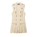 Beige sleeveless trench mini dress front view, epaulet details, double‑breasted buttons, side patch pockets, ruffle hem