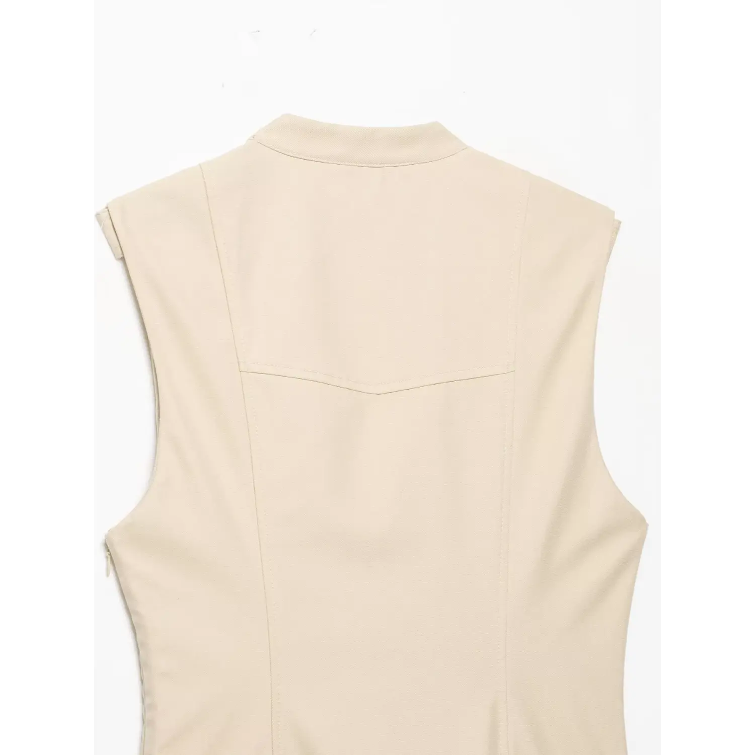 Close‑up back view, stand collar and tailored yoke stitching of beige sleeveless trench dress