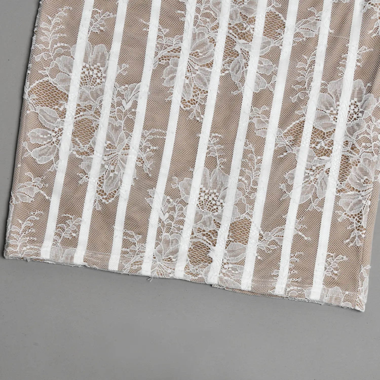 Flat lay bottom hem and back slit detail beige white floral lace corset maxi dress
