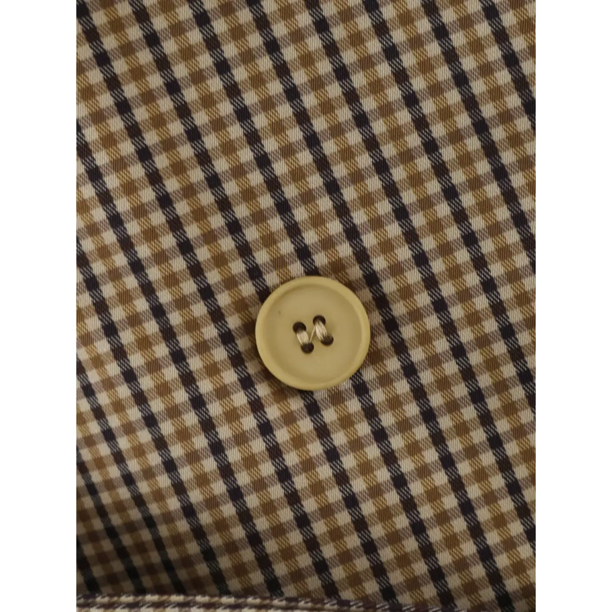 Close-up of gingham front button