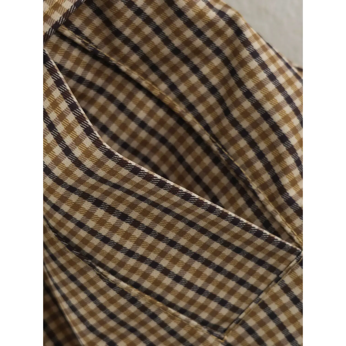 Close-up of gingham inner placket and seam