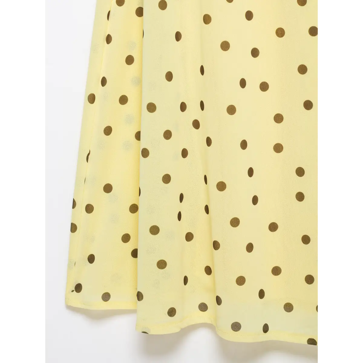 Bias draped chiffon fabric close yellow base big brown polka dot print