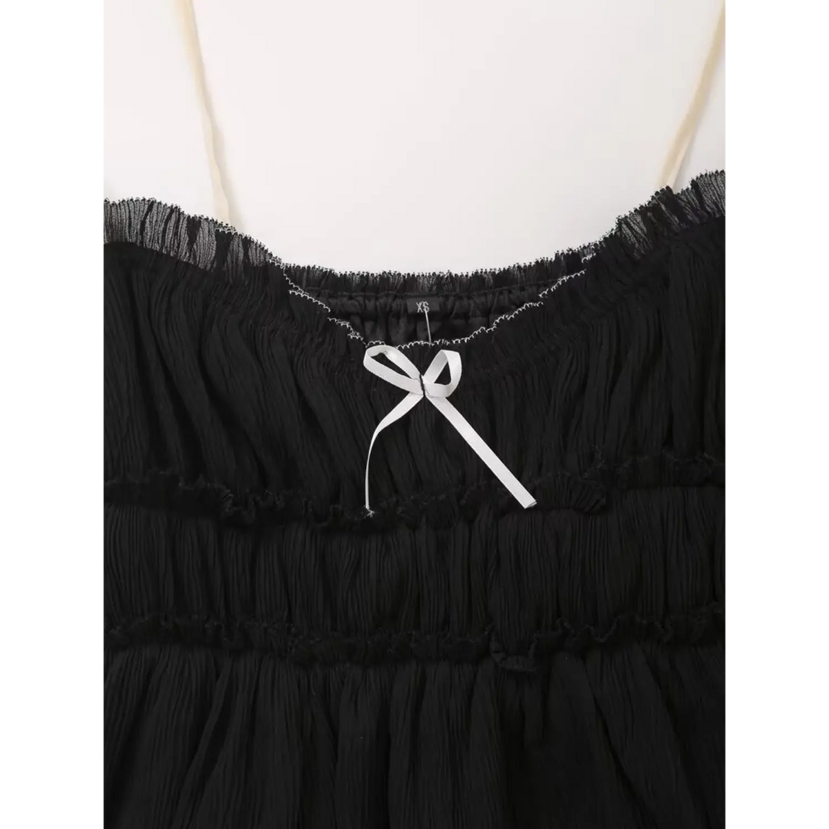Close-up of white bow at sweetheart neckline