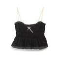 Front flat lay of black bow smocked ruffle cami top