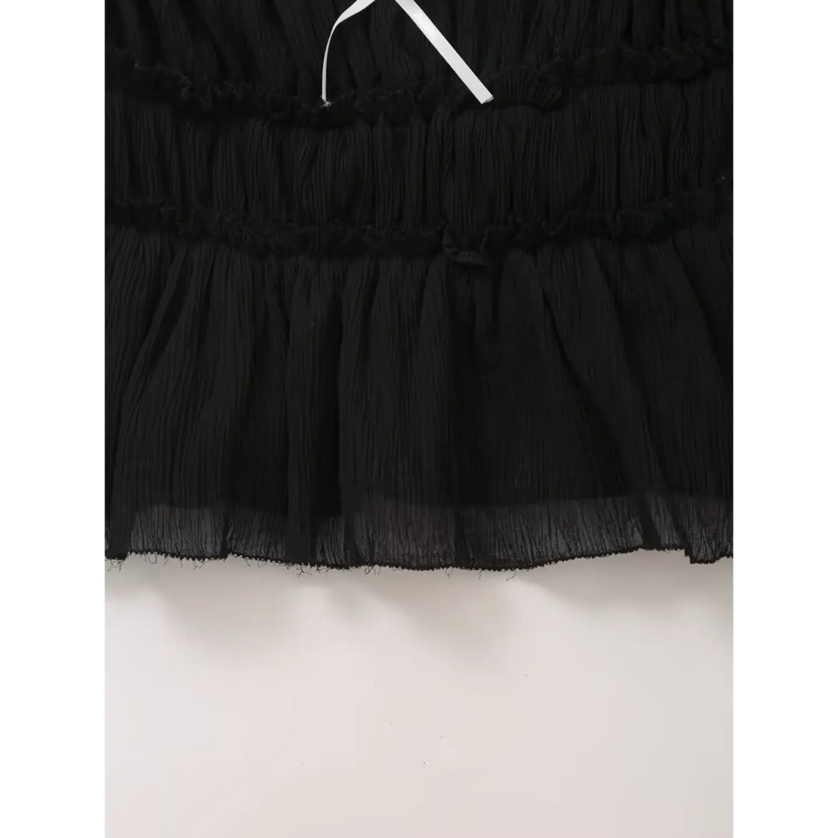 Close-up of ruffled hem