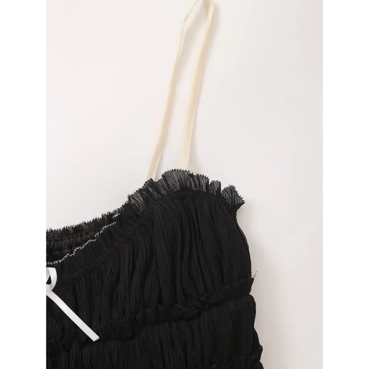 Close-up of off-white adjustable shoulder strap