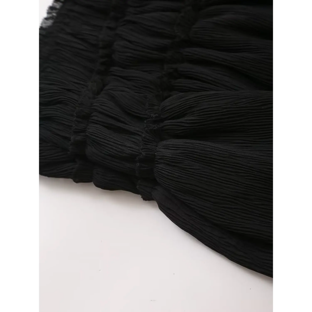 Close-up of smocked plisse texture