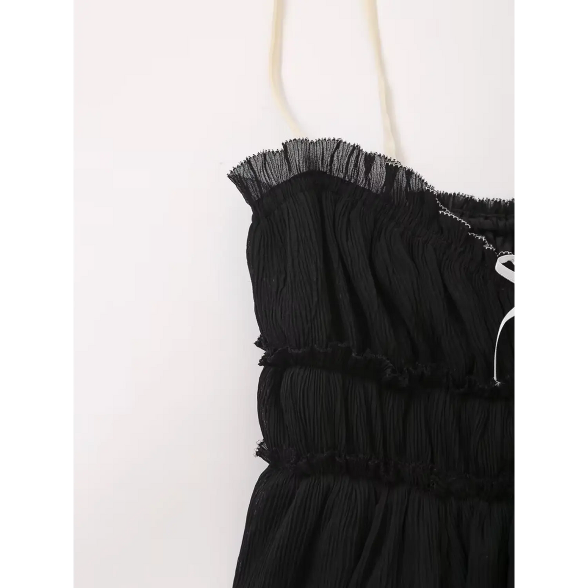 Close-up of ruffled shoulder strap