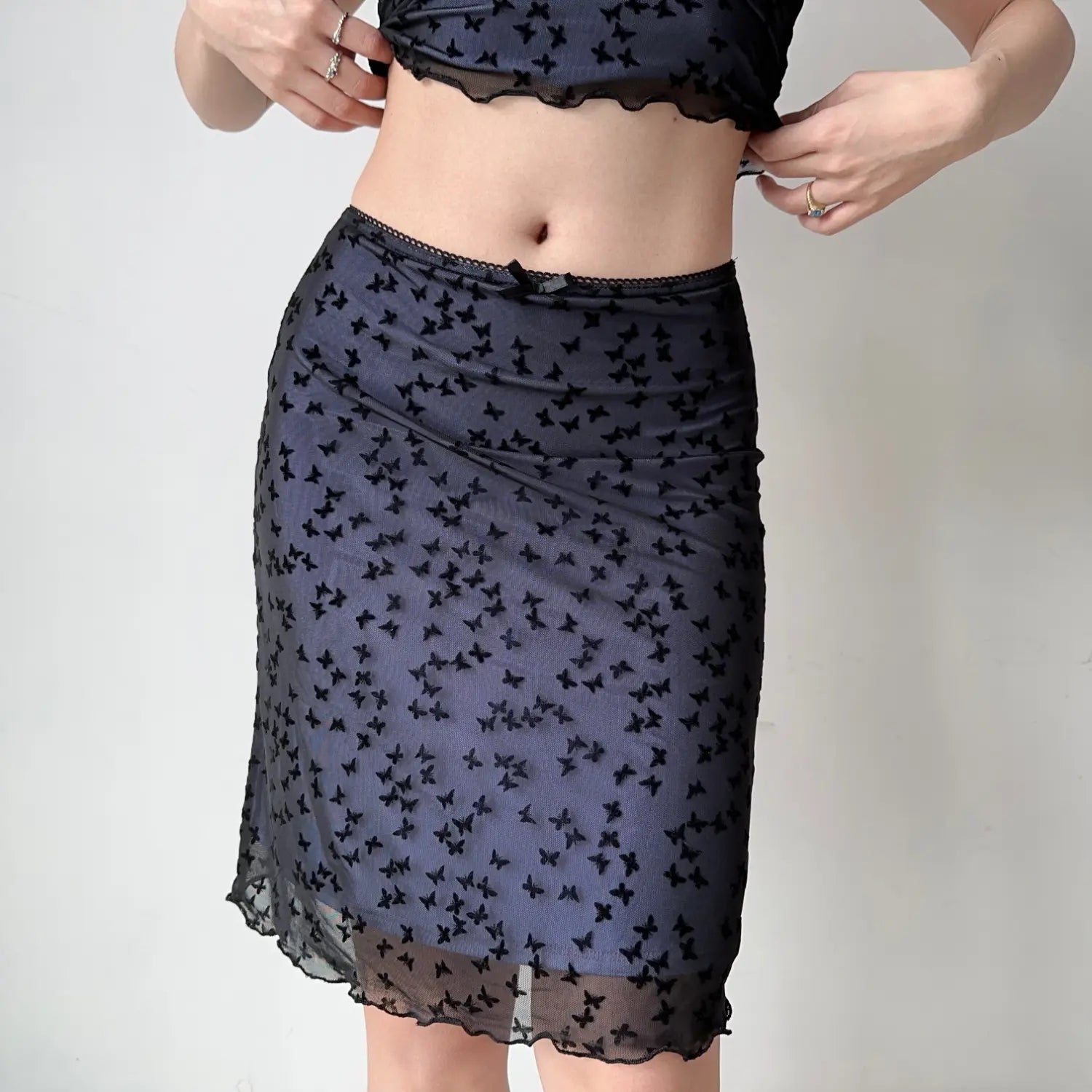 Waist detail black mesh midi skirt covered flock butterfly pattern, elastic lace waistband with mini satin bow, ruffle hem sheer overlay